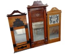 Three antique Continental hall mirrors.