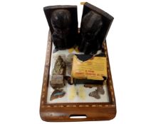 A 20th century tourist butterfly tray together with a pair of carved African bookends,