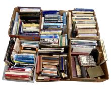 A pallet containing six boxes of hard and soft cover,