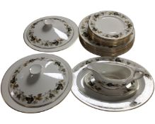 A 21 piece Royal Doulton Larchmont dinner service together with a further blue and white meat plate.