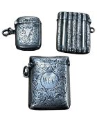 Three antique silver vesta cases.