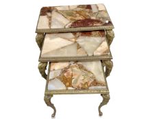 A nest of three gilt and onyx tables.