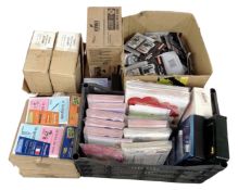 Four boxes containing greetings cards, travel sewing kits, Kiwi shoe cleaning wipes, hole punches,