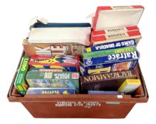 A box containing a quantity of assorted board games.