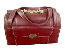 A vintage Burgundy leather stitched bag.