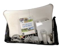 A Nintendo Wii with Wii sports, leads, Wii Fit board and controller.