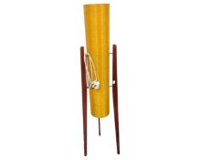 A 1970s floor standing rocket lamp on teak legs.