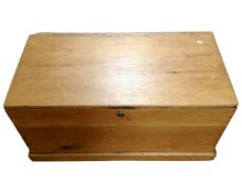 An antique pine blanket box.