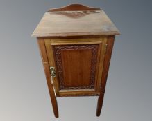 An Edwardian mahogany pot cupboard.