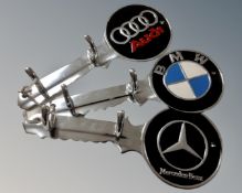 Three aluminium key holder plaques, Audi, BMW and Mercedes.