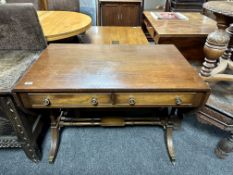 A mahogany Regency style sofa table fitted with two drawers.