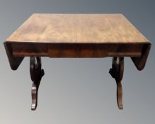 A 19th century mahogany flap sided sofa table fitted with a drawer.