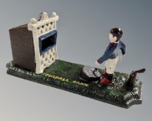 A cast iron novelty footballer money box.