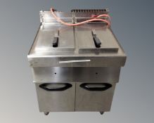 A stainless steel commercial double fryer.
