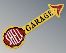 A cast iron Shell garage arrow wall plaque.