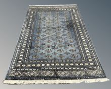 A Lahore Bokhara rug on blue ground, Pakistan, 170cm by 250cm.