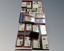 A box containing five albums of First Day Covers together with two further albums of postcards and