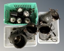 Three crates containing theater spotlights.