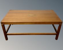 A rectangular mahogany campaign style coffee table with brass mounts.