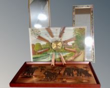 A 1970s Paico sunburst wall clock together with an oil on board and two hall mirrors.