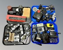 A collection of vintage SLR and point and shoot cameras including a Nikon AF600,