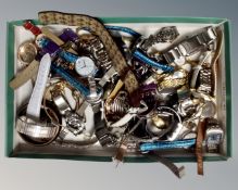 A box containing a large quantity of assorted wristwatches.