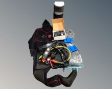 An Otter Watersports Ultimate wetsuit with boots together with an air tank and a box containing
