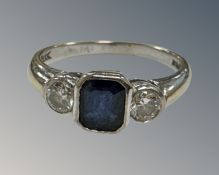 An 18ct yellow gold two stone diamond and sapphire ring, size N.