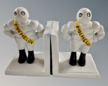 A pair of cast iron novelty Michelin Man bookends.