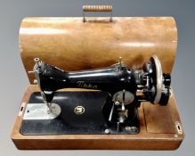 A 20th century Tikka manual sewing machine, in case.