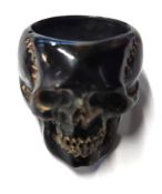 A black skull carved from cow bone.