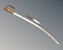 A bowie knife together with a reproduction sabre.