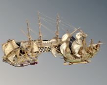 A box containing three wooden galleons.