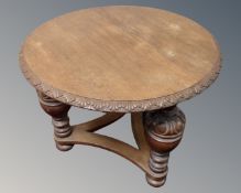 A 20th century circular oak occasional table on bulbous legs.