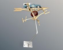 A cast iron Land Rover weather vane.