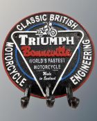 A cast iron Triumph Bonneville circular coat hook