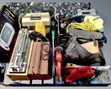 A pallet containing toolboxes, tilecutter, power tool cases, 110v extension lead, foot pump, sander,