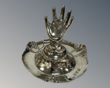 A silver ring stand, 1912 Birmingham hallmarks, height 7cm.