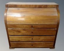 A 19th century continental mahogany cylinder bureau fitted with four drawers.