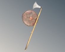 A replica Viking battle axe together with a shield.