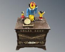 A cast iron novelty organ grinder money box.