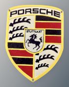 A cast iron Porsche wall plaque.