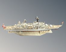 A continental wooden model of a battleship.