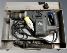 An Elu 110v hammer drill in case.