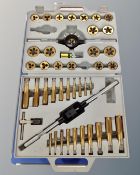 A heavy duty metal bench vice together with a tungsten tap and die set in case