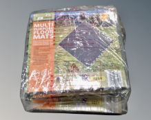 Four packs of four sealed floor mats