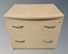 An office filing chest in a pine finish