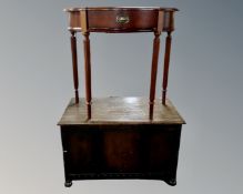 An oak panelled blanket box and a hall table fitted a drawer