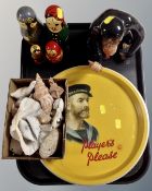 A tray of ceramic figure of a monkey, Russian dolls,