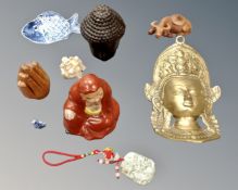 A far Eastern brass figure, together with carvings, Chinese pendant,